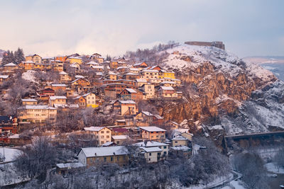 Townscape against sky during winter