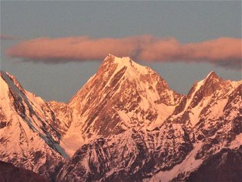 Scenic view of snowcapped mountains against sky during winter
