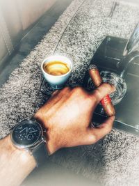 Close-up of hand holding drink