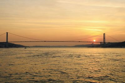 View of suspension bridge at sunset