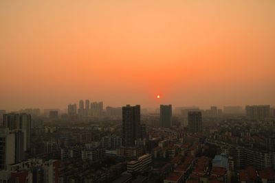 High angle view of city at sunset