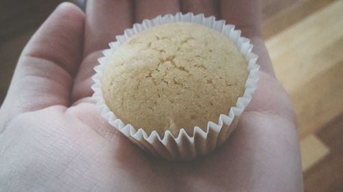 Close-up of hand holding mini muffin