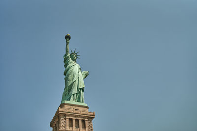 Low angle view of statue against clear sky