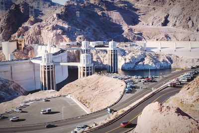 High angle view of cars on road by mountain