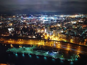 High angle view of illuminated buildings in city at night