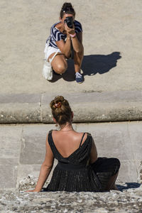 Rear view of woman standing outdoors