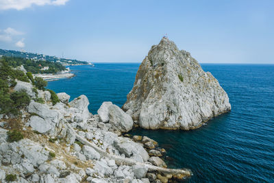 Aerial view of rock cliff diva in simeiz sea resort beach in crimea, drone shot. 