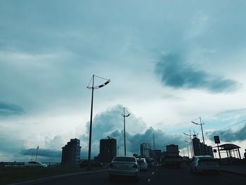 Cars on road against sky