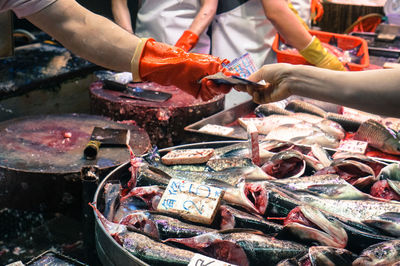 Cropped image of people at market stall