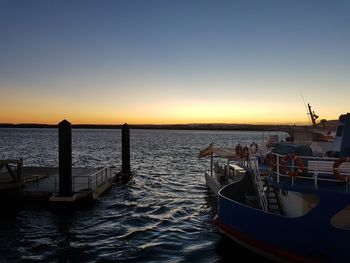 Scenic view of sea against clear sky during sunset