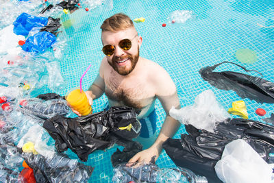 Portrait of young man in swimming pool