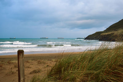 Scenic view of beach against sky