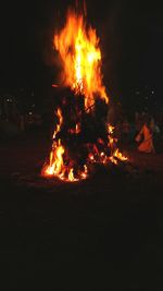 Bonfire on field at night