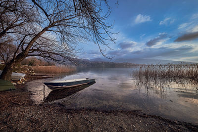 Scenic view of lake against sky during winter