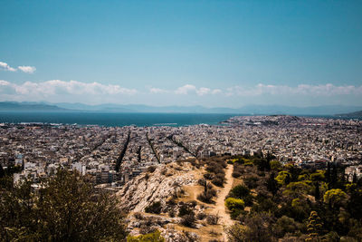 Aerial view of city against sky