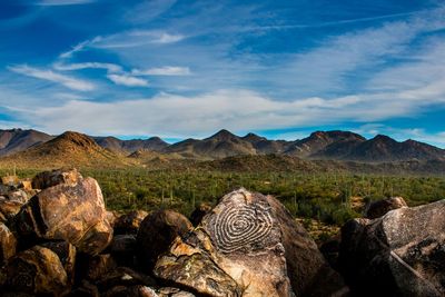 Scenic view of mountains against cloudy sky