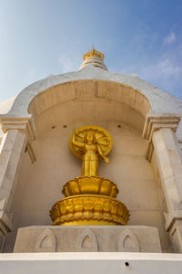 Low angle view of statue against building