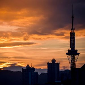 Silhouette of city at sunset