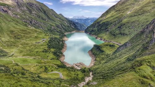 Scenic view of lake and mountains against sky