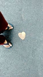Low section of people walking on road