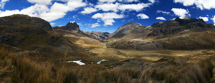 Panorama of mountains and valley in the remote cordillera huayhuash circuit near caraz in peru.