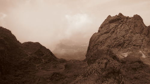 Panoramic view of rock formations against sky