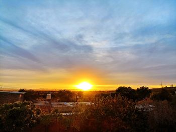 View of townscape against sky during sunset