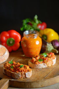 Close-up of food on table against black background