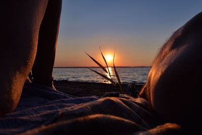 Close-up of sea against sky during sunset