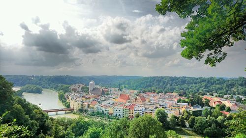 High angle view of town against cloudy sky