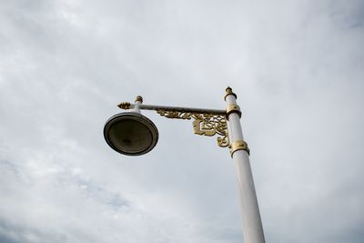 Low angle view of street light against sky