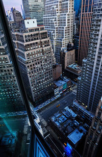 High angle view of street amidst buildings in city of manhattan new york