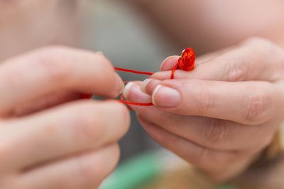 Close-up of hand holding ladybug