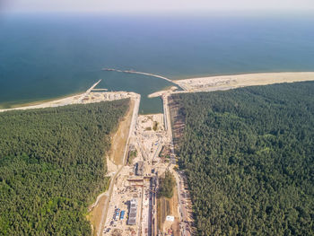 High angle view of trees by sea
