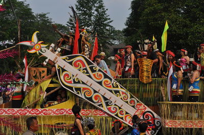 People wearing costumes during traditional festival