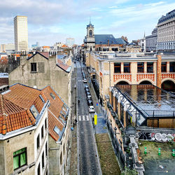 High angle view of street and buildings against sky