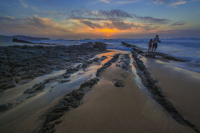 Scenic view of sea at sunset