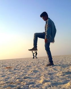 Full length of man on snow covered land