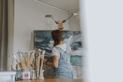 Artist painting in studio