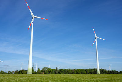 Modern wind turbines with a clear blue sky seen in germany