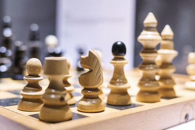 Close-up of chess pieces on table