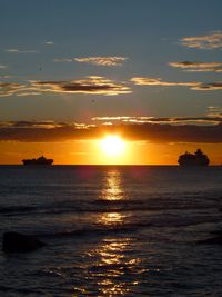 Scenic view of calm sea at sunset