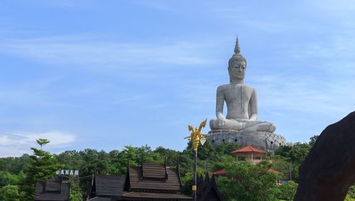 Low angle view of statue against sky