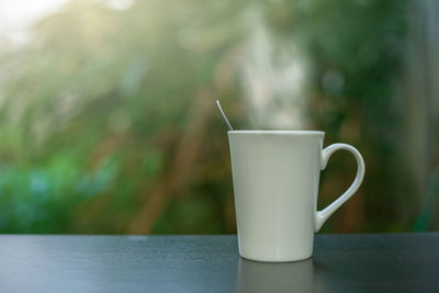 Close-up of coffee cup on table