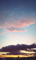 Low angle view of dramatic sky during sunset