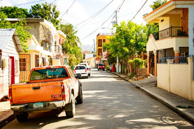 View of street amidst buildings in city