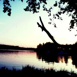 Scenic view of calm lake at sunset