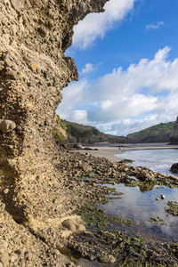 Rock formation and black sand beach