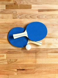 High angle view of ping-pong and table paddle