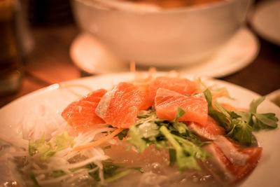 Close-up of fish served in bowl on table